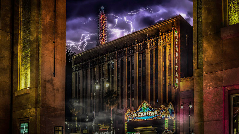 Stormy night over an ornate historic movie theater with a glowing marquee and vertical neon tower on a Los Angeles street, purple sky streaked with lightning, foggy sidewalk and lit street lamps.
