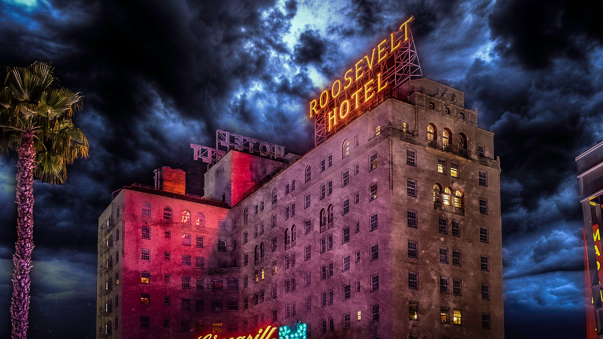 Moody, cinematic night view of a historic Hollywood hotel with a glowing rooftop neon sign, lit windows, a palm tree in the foreground, and dramatic storm clouds
