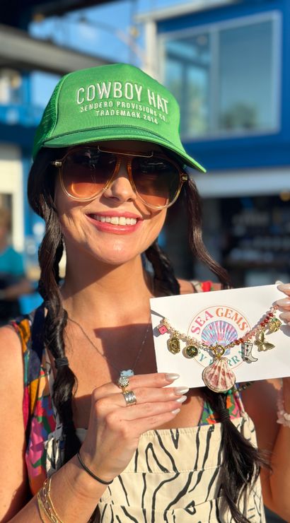 Smiling shopper wearing a green