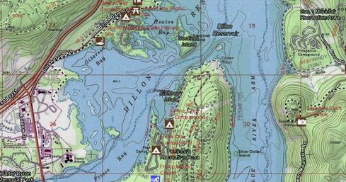 Topographic map of Dillon Reservoir showing contour lines, Sentinel and Fishhook Islands, a forested peninsula with campgrounds and trails, nearby roads and reservoir arms — colorful recreational map view.
