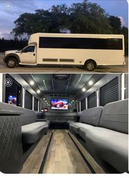 White luxury party bus parked at dusk with tinted windows; interior shot shows gray leather bench seating, wood‑look floor, LED ceiling lights and a flat-screen TV for group transport.
