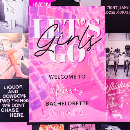 Hot pink welcome sign for a bachelorette party in Scottsdale, AZ reading “Let’s Go Girls” on an easel with a glossy mosaic background and retro pin-up collage.