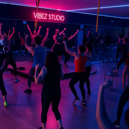 Vibrant neon-lit mirrored fitness studio hosting a high-energy group dance workout, instructor leading participants in athletic wear with arms raised.