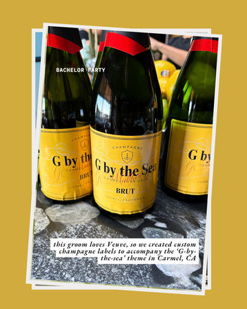 Three champagne bottles with bright yellow custom 'G by the Sea' Brut labels on a marble surface, party-ready for a bachelor celebration in Carmel, CA