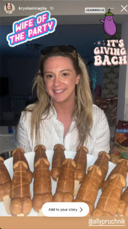 Smiling woman in a home kitchen holding a platter of penis-shaped cake pops at a bachelorette party, with playful 'Wife of the Party' and 'It's Giving Bach' stickers.