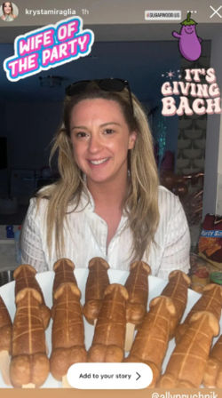 Smiling woman at a home bachelorette party holding a plate of novelty penis-shaped pastries, with playful stickers saying “Wife of the Party” and “It’s giving BACH” in the background.