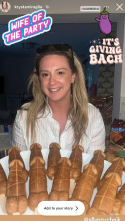 Smiling woman in a home kitchen holding a plate of phallic-shaped pastry snacks at a bachelorette party, with playful stickers reading 'Wife of the Party' and 'It's Giving Bach'.