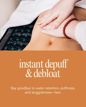 Close-up of hands massaging a bare abdomen on a towel, wellness spa scene promoting instant depuff & de-bloat abdominal massage to reduce bloating and water retention.