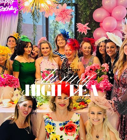 Smiling women wearing colorful fascinators at an indoor birthday high tea with pink balloons, floral centerpieces and a tea spread.