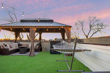 The Lyric: Modern 4-Bedroom Retreat with Rooftop Access and Fire Pit image 6