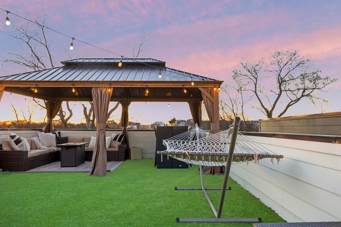 The Lyric: Modern 4-Bedroom Retreat with Rooftop Access and Fire Pit image 6