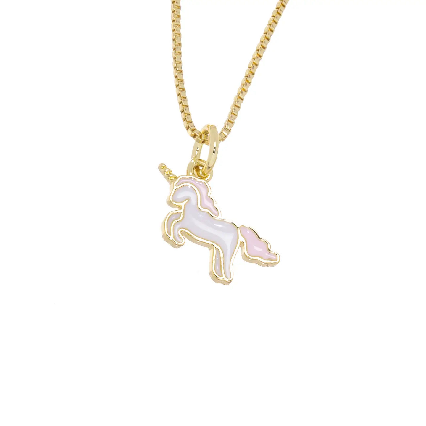 Playful gold necklace with a white and pink enamel unicorn charm, close-up on a white background