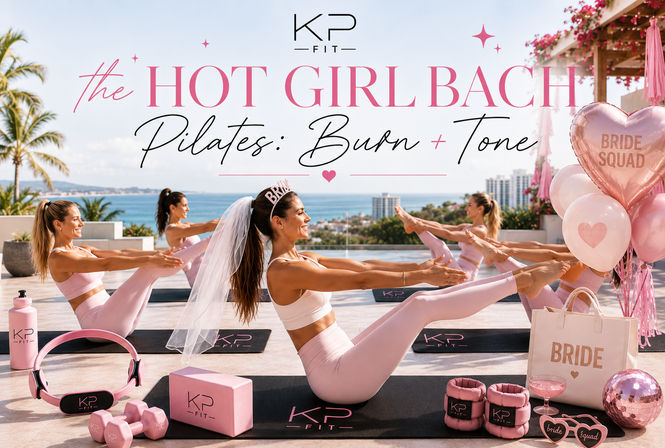 Bachelorette Pilates class on an ocean-view rooftop — women in matching pink activewear doing boat pose with a bride-to-be in a veil, pink balloons, mats and fitness props.