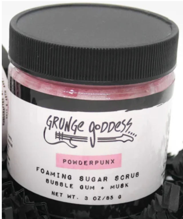 Small jar of pink foaming sugar scrub with black screw lid labeled Powderpunx, bubble-gum + musk scent, 3 oz.