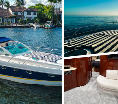 Luxury motor yacht with navy hull docked at a palm‑lined waterfront; bow sunpad on calm open sea; elegant cabin salon with curved white leather sofa and glossy wood trim.