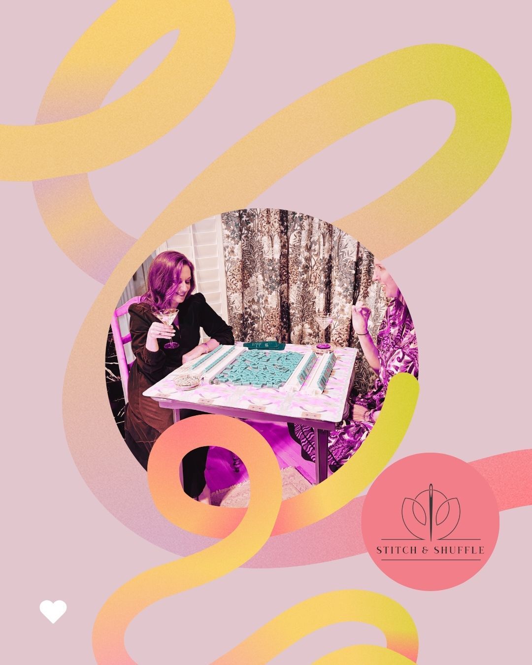 Two friends enjoying a mahjong night indoors, laughing over a tile-filled game table with cocktails, set against floral curtains and playful pink-yellow swirls.