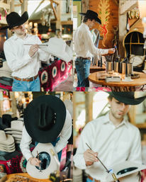 Artisan cowboy hat maker shaping and decorating a white western hat in a rustic hat shop, stacked hats and wooden décor in the background — handcrafted cowboy hats, western workshop vibe.