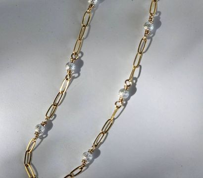 Gold paperclip chain necklace dotted with sparkly textured silver beads, flat-lay on white background — chic fashion accessory
