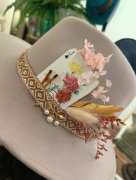 Chic blush felt fedora with woven geometric band, tucked Jack of clubs floral playing card, pink blossoms, gold feather and pearl charm accents