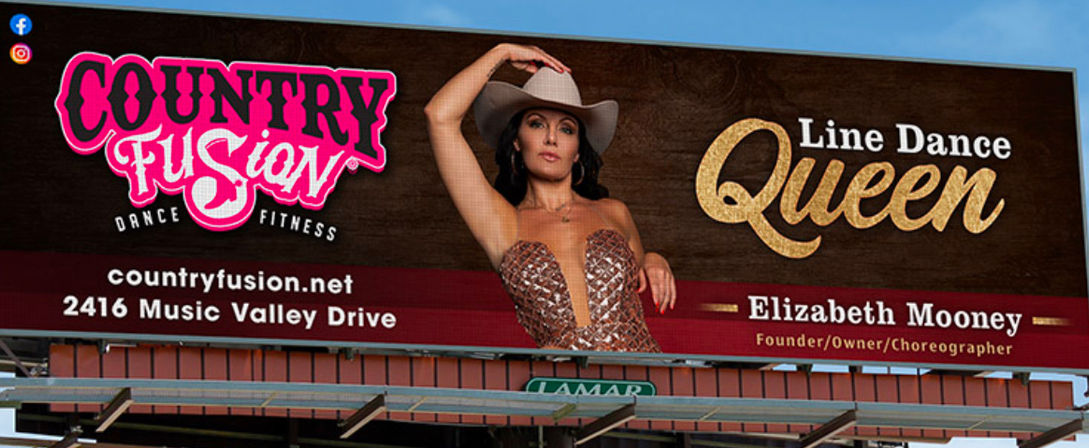 Roadside billboard promoting country-style dance fitness, showing a woman in a sequined outfit and cowboy hat striking a pose with a bold "Line Dance Queen" headline and bright logo-style graphics on a wood-grain background above Music Valley Drive.