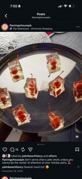 Clear gelatin jello shots with maraschino cherries on stems arranged on a round silver serving tray — a festive holiday party appetizer.