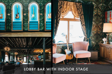 Retro-chic hotel lobby bar with indoor stage, illuminated arched niches showcasing electric guitars, pink velvet lounge chairs by a sunlit window, a guitar on a stand with amplifier, patterned wallpaper and warm ambient lighting.