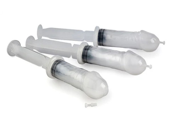 Product shot of three capped disposable plastic syringes (no needles) filled with white gel or cream, arranged on a clean white background.