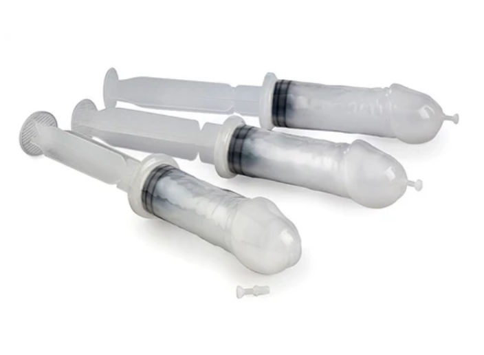 Three translucent white disposable plastic syringes with plungers and rounded sealed tips arranged on a white background