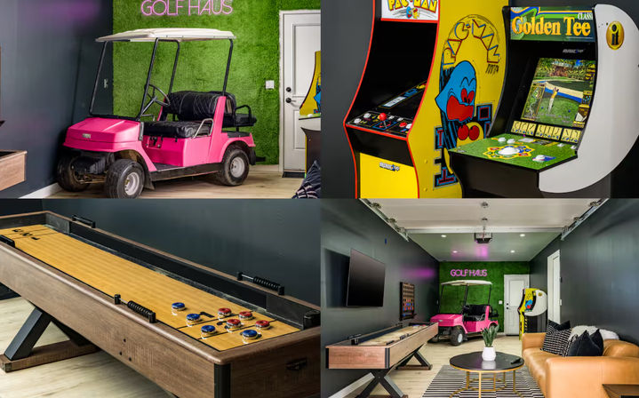 Vibrant indoor game room with a pink golf cart, classic arcade cabinets, long shuffleboard table, turf accent wall and cozy lounge seating.