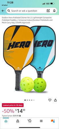 Two bright pickleball paddles (orange and teal) with HERO graphics and two neon green perforated balls — starter kit product photo on a white background.