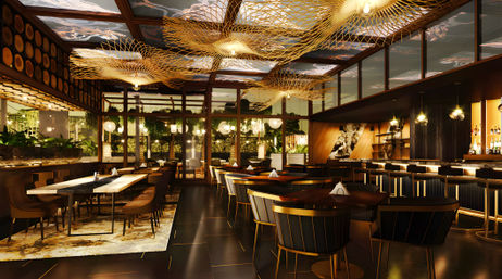 Chic modern restaurant interior with sculptural golden ceiling lights, floor-to-ceiling glass walls, plush banquette and table seating, and a glowing backlit bar creating a warm urban evening dining vibe.