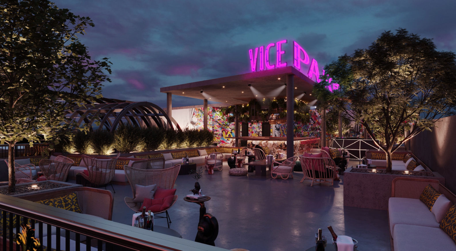 Vibrant rooftop bar at dusk with neon-lit canopy, colorful mural, cozy lounge seating and planted trees