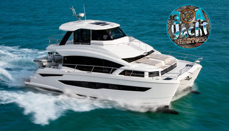 Sleek white luxury motor yacht cruising through turquoise tropical waters, sunlit decks and frothy bow wake