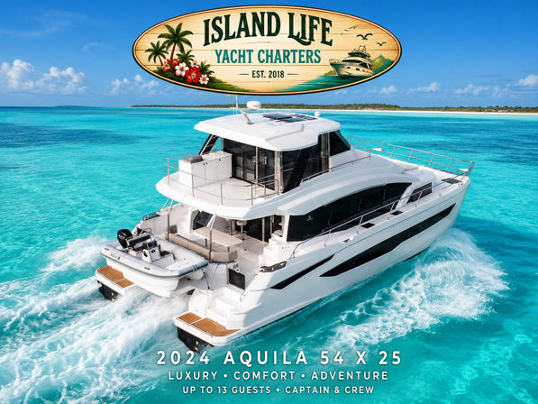 White 2024 Aquila 54x25 luxury yacht cruising turquoise tropical water near a palm-lined island, with an oval wooden sign advertising yacht charters overhead.