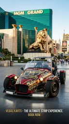 Eye-catching open-top sports kart with red-and-gold graphics parked on the Las Vegas Strip, golden lion statue and green high-rise hotel in the background with pedestrians strolling.