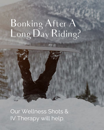 Upside-down snowboarder buried in snow with board raised against a snowy mountain backdrop, overlaid text promoting wellness shots and IV therapy for post-ride bonking.