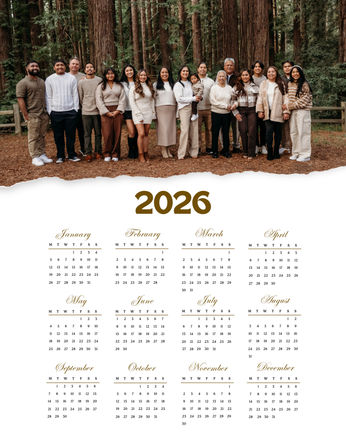 Multigenerational family portrait in a redwood forest wearing neutral earth tones, posed above a clean 2026 calendar layout — outdoor holiday family photo for a personalized calendar.