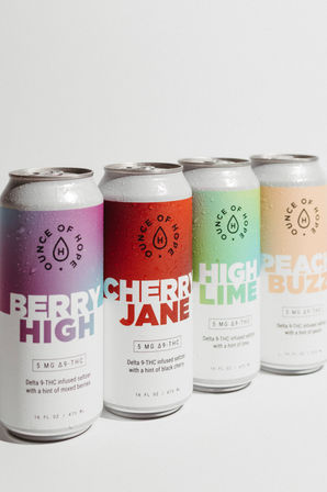 Four chilled 16 oz Delta‑9 THC seltzer cans with colorful berry, cherry, lime, and peach labels and water droplets on a clean white background.