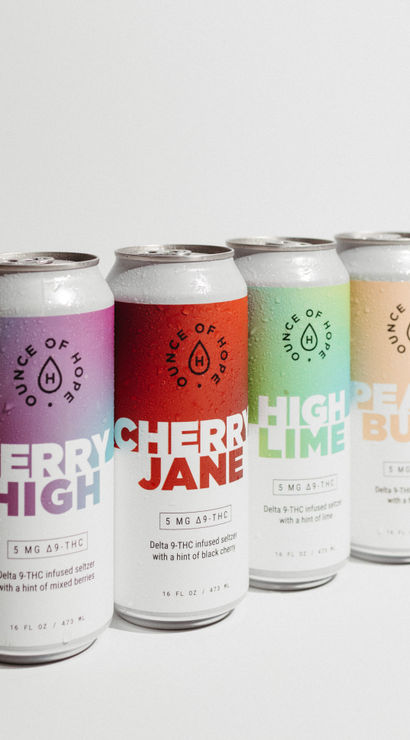 Four chilled 16 oz Delta‑9 THC seltzer cans with colorful berry, cherry, lime, and peach labels and water droplets on a clean white background.