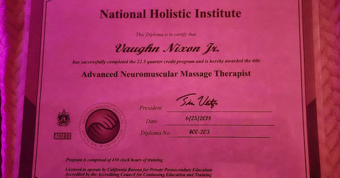 Bright pink diploma-style certificate awarding the title Advanced Neuromuscular Massage Therapist, showing an embossed seal, signature and date (6/25/2018) on a textured fabric background — massage therapist certificate photo.
