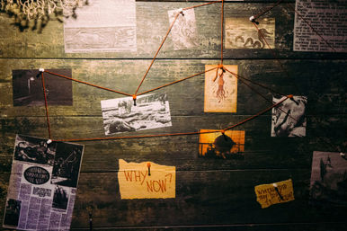 Conspiracy-style investigation board on weathered wood with vintage maritime clippings, kraken illustration, black-and-white photos, red string connections and a yellow note reading "WHY NOW?"