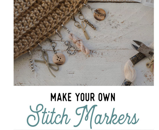 DIY knitting stitch markers clipped to a chunky tan knit, featuring wooden buttons, metal charms, beads and embroidery floss next to craft pliers on a distressed white wood surface