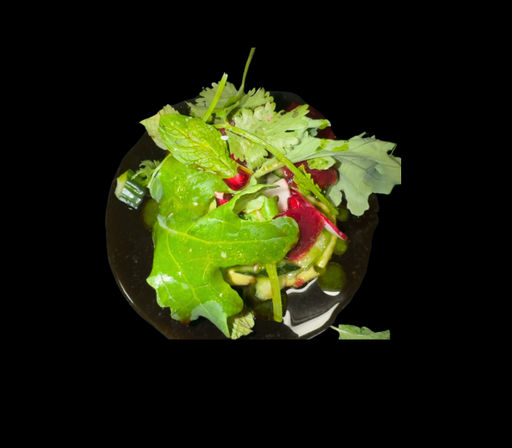 Vibrant mixed green salad with peppery arugula, baby leaves and sliced red beets lightly dressed on a glossy black plate