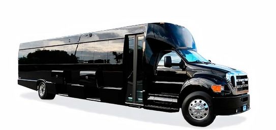 Sleek black luxury party bus shuttle with open passenger door, chrome wheels and city skyline reflected on its glossy side, isolated on white background