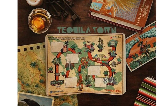 Vintage travel flatlay featuring a 'Tequila Town' game board with agave illustrations, a cocktail glass, a passport and a map of Mexico on a wooden table