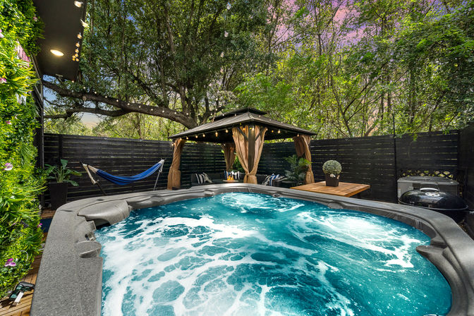 The Black House: Downtown Escape with Hot Tub, Chef, Stylish Decor, Massage & Mixology Class image 35