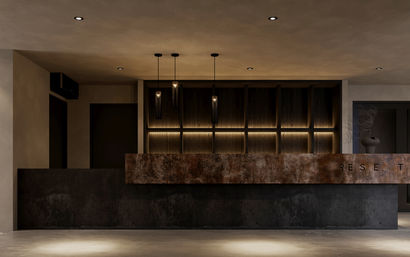 Moody modern hotel reception desk in a minimalist lobby with a rusted metal front, dark wood backlit shelving, hanging pendant lights and concrete floor