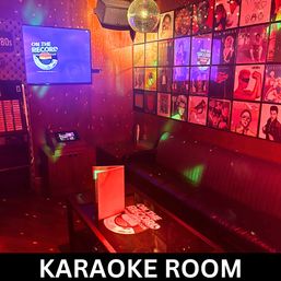 Retro 80s–themed private karaoke room with disco ball, neon lighting, leather booth, and vinyl album wall art.