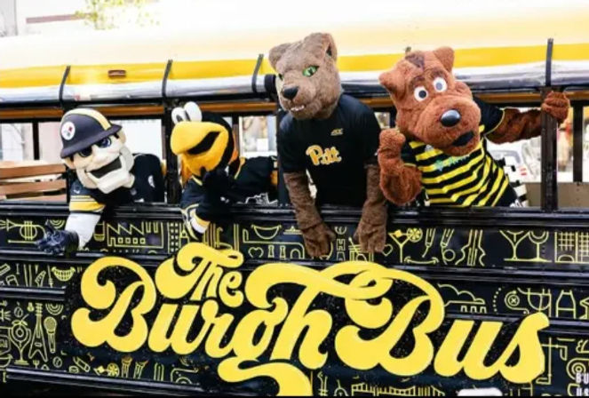 Yellow-and-black decorated bus with four playful sports mascots — a panther, a bee and two costumed characters — leaning from the windows in a festive street scene.