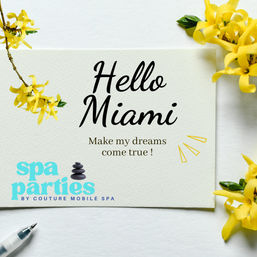 Flat-lay spa-themed card reading 'Hello Miami — Make my dreams come true!' surrounded by bright yellow flowers, a pen, and turquoise spa text — cheerful Miami greeting